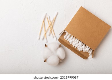 White cotton swabs on concrete texture background. Cotton buds. Bamboo cotton buds. Eco friendly. Hygienic cotton swabs for ears. Place for text. Place to copy. - Shutterstock ID 2311999087