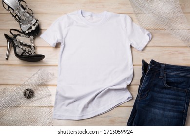 White Women’s Cotton T-shirt Mockup With Black Open Toe Heels Sandals And Jeans. Design T Shirt Template, Tee Print Presentation Mock Up