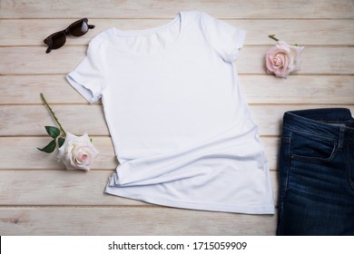 White Women’s Cotton T-shirt Mockup With Pink Roses, Jeans And Sunglasses. Design T Shirt Template, Tee Print Presentation Mock Up