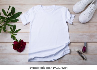 White Women’s Cotton T-shirt Mockup With Sport Shoes, Burgundy Peony, Nail Polish And Lipstick. Design T Shirt Template, Tee Print Presentation Mock Up