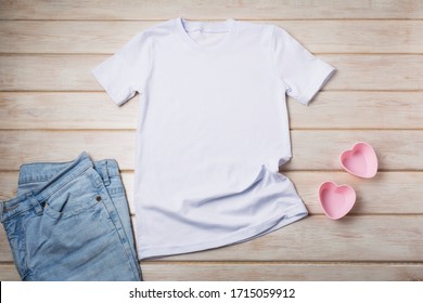 White Women’s Cotton T-shirt Mockup With Two Pink Heart Cookies Molds. Design T Shirt Template, Tee Print Presentation Mock Up