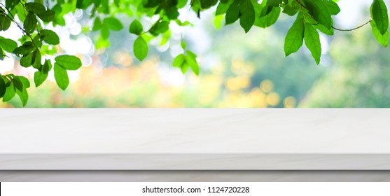 White Counter, Kitchen Table Top And Blur Perspective Green Tree In Summer Nature Background, White Marble Counter For Kitchen Product Display Backdrop, Stone Shelf, Table Top Surface For Banner