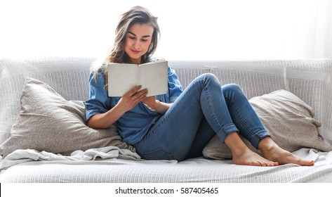 White Cozy Bed And A Beautiful Girl, Reading A Book, Concepts Of Home And Comfort, Place For Text