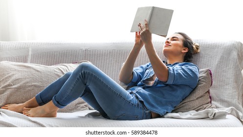 White Cozy Bed And A Beautiful Girl, Reading A Book, Concepts Of Home And Comfort, Place For Text