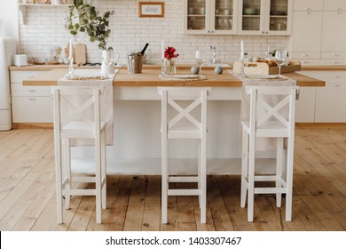 White Cozy Kitchen Island Table At Home Interior. Small Empty Food Space Provence Backdrop With Light Wooden Counter. Cozy Tall Chair At Traditional Desk. Modern Dinner With Champagne