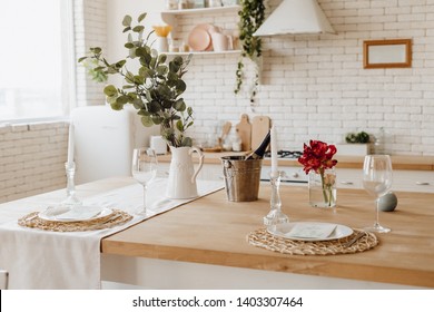 White Cozy Kitchen Table At Home Provence Interior. Champagne Bottle In Ice Bucket For Homey Dinner Date On Light Wooden Counter. Cozy Traditional Desk On Modern Brick Wall Background