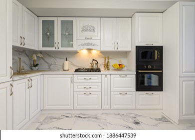 White cozy modern classic kitchen interior with wooden furniture and appliances, front view - Shutterstock ID 1886447539