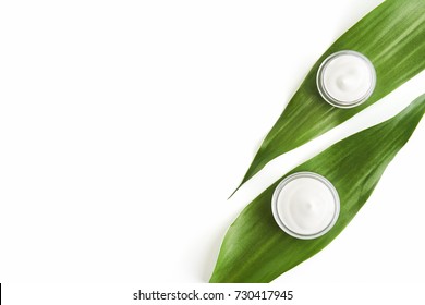 White cream bottle placed, Blank label package for mock up on a green foliage background. The concept of natural beauty products. - Shutterstock ID 730417945