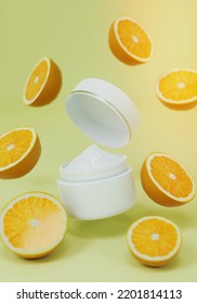 The White Cream Jar Rests On A White Background With Orange Friut Surrounding.