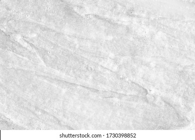 White Cream Texture. Surface Of Yogurt And A Smoothie Of Whipped Cream Smoothie. Background Texture Of Masks And Scrubs For Face And Body. Pearlescent Silver Surface Of The Foam.