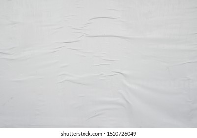 White creased weathered street poster glued up with wallpaper paste - Shutterstock ID 1510726049