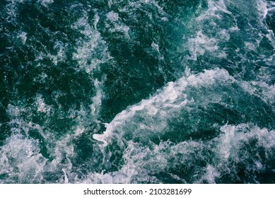 White crest of a sea wave. Selective focus. Shallow depth of field.