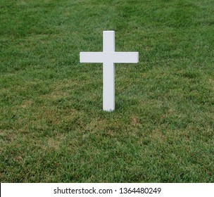 White Cross Grave Maker Standing Alone In Arlington National Cemetery