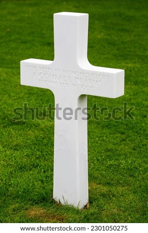 white cross for unknown soldier in spring at american memorial and military cemetery of Margraten in the netherlands