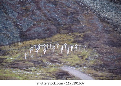The white crosses of the historic graveyard cemetery, built in 1918 after miners died of the Spanish flu, also known as the 1918 influenza pandemic, in Longyearbyen, Spitsbergen, Svalbard, Norway.