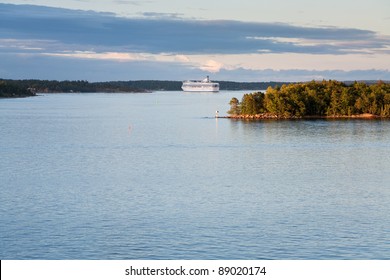 White Cruise Liner In Baltic Sea At Sunset