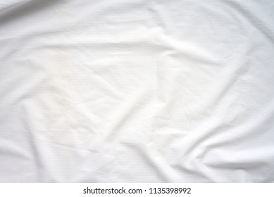 White Crumpled Bedspread Soft Fabric Textured Background