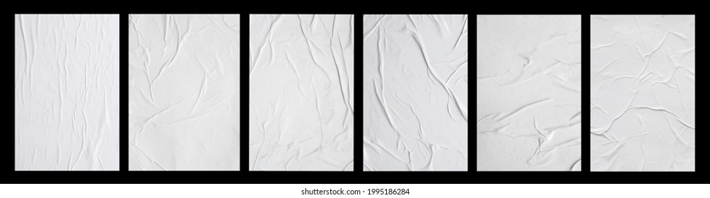 white crumpled and creased glued paper poster set isolated on black background - Shutterstock ID 1995186284