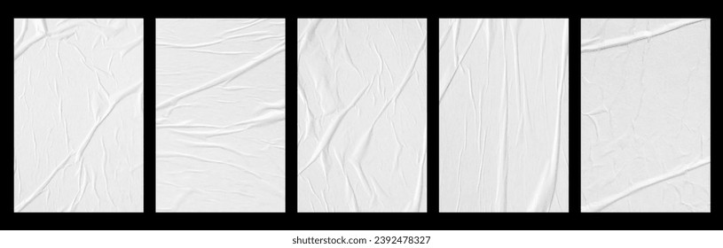 white crumpled and creased glued paper poster set isolated on black background