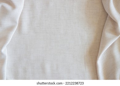 White Crumpled Linen Fabric Texture Background. Natural Off White Wavy Linen Organic Eco Textiles Canvas Background. Top View