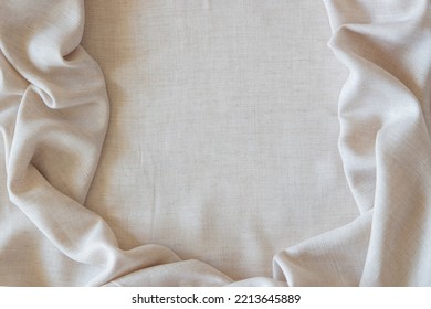 White Crumpled Linen Fabric Texture Background. Natural Off White Wavy Linen Organic Eco Textiles Canvas Background. Top View