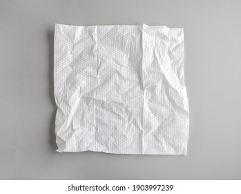 White Crumpled Paper Napkin On Grey Background, Top View