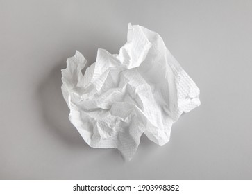 White Crumpled Paper Napkin On Grey Background, Top View