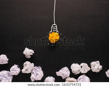 Similar – Question mark, paper balls, light bulb with pens