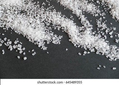 White Crystals Sea Salt Isolated On Black Background