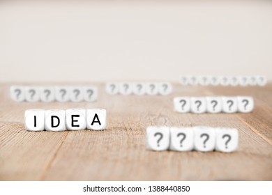 White cube blocks with question marks and Idea letters imprinted on cube surface, focused on Idea cubes; concept of Thinking, Idea and Success