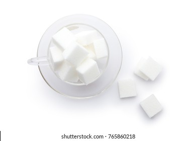 White Cube Sugar In A Glass Cup On White Background. Top View.