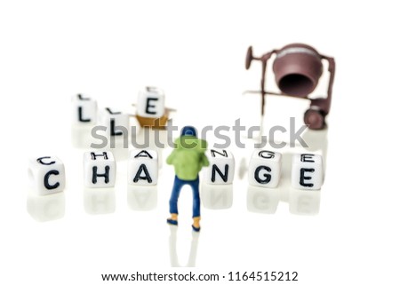 White cubes with word challenge creating new word change, personal development and career growth or challenge yourself concept, white background with miniature figurines watching at it