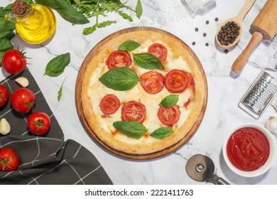 White Culinary Background With Margarita Pizza On A Wooden Board And Ingredients.