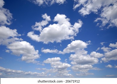 White Cumulus Clouds And A Blue Sky.