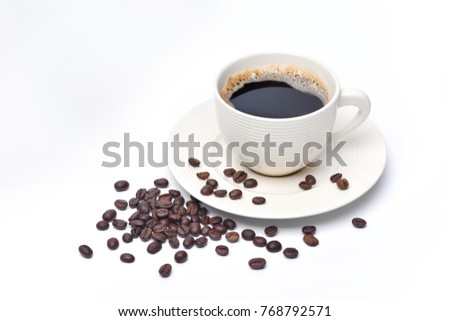 White cup of coffee and coffee beans on white background