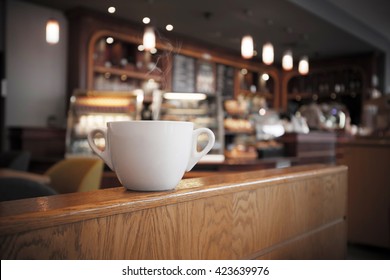 White Cup Of Coffee At The Cafe Interior