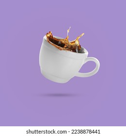 White cup of coffee levitating on violet background - Shutterstock ID 2238878441