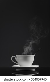 White Cup Of Coffee With Smoke 