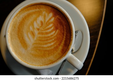 White Cup Of Espresso Coffee Close Up With Beautiful Tree Patern From Milk Foam In The Cup.