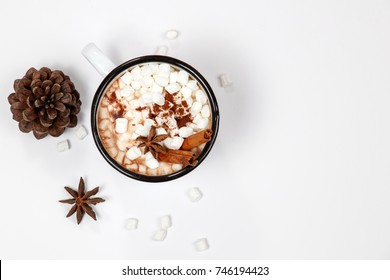 White Cup Of Hot Chocolate Drink With Marshmallows And Cinnamon On White Background. Winter Time. Christmas Holiday Concept. Flat Lay. Top View.