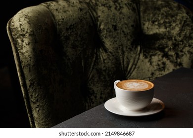 White Cup Of Hot Latte Coffee With Beautiful Milk Foam Latte Art Texture Isolated On Dark Background. Overhead View, Copy Space. Advertising For Cafe Menu. Coffee Shop Menu.