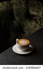 White Cup Of Hot Latte Coffee With Beautiful Milk Foam Latte Art Texture Isolated On Dark Background. Overhead View, Copy Space. Advertising For Cafe Menu. Coffee Shop Menu.