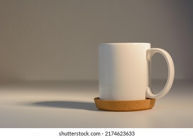 White Cup On Natural Warm Light Background.