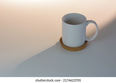 White Cup On Natural Warm Light Background.