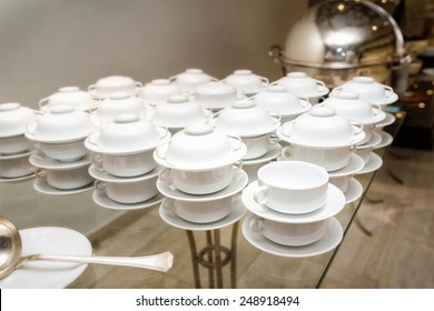 White cups on the table.