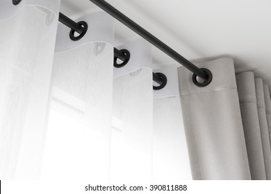 The white curtains with ring-top rail