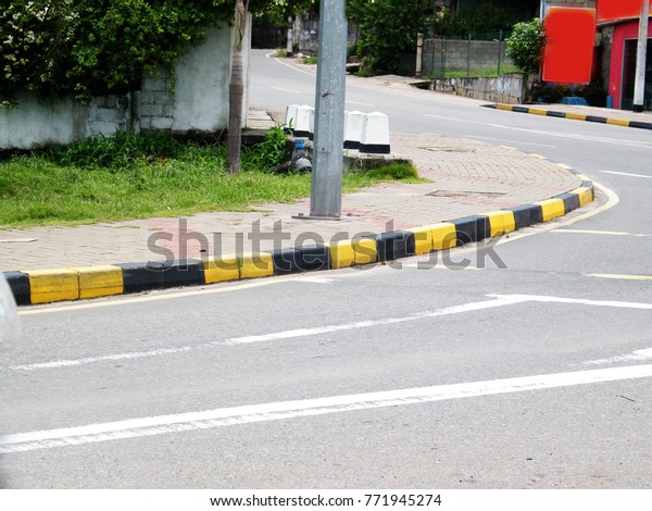 White curved city\
road marking. Road bend