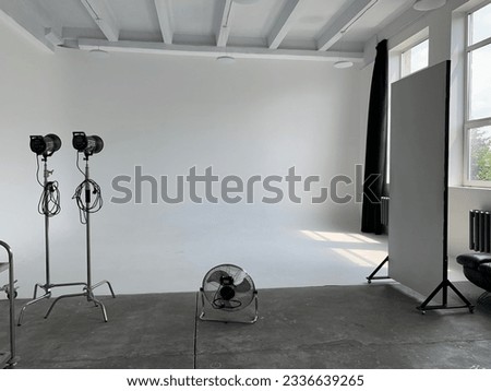 white cyclorama in professional photostudio. daylight on white background. professional equipment 