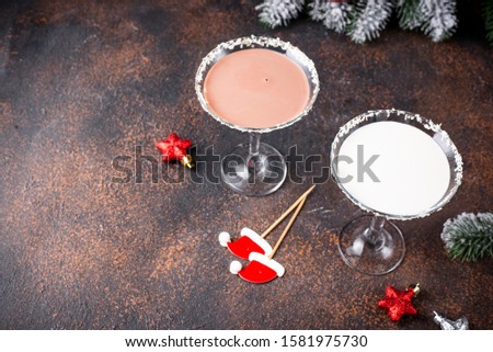 White and dark chocolate snowflake martini cocktail. Christmas drink