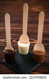 White And Dark Chocolate. Spoon With Dark, Milk And White Chocolate